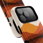 Close-up of smartphone with protective case showing orange and brown abstract pattern, highlighting camera lens size