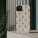 Desert Diamonds – Pastel Geometric Pattern MagSafe Phone Case, glossy diagonal dual-camera model, rear view on a tabletop