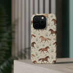 Wild Mustangs – Western Horse Pattern MagSafe Phone Case, glossy square triple-camera Pro model, rear view on a tabletop