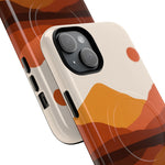 Two phone cases shown in different sizes with abstract brown and orange mountain and sun design