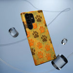 Samsung Galaxy S22 Ultra phone case with orange and brown paw print pattern