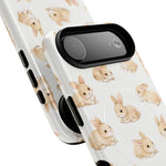 Two white phone cases with cute brown bunny pattern, shown in different sizes with camera cutouts