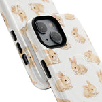 Two sizes of white phone cases with cute beige bunny pattern, showing differences in variant size
