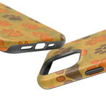 Close-up of dog paw print patterned phone case showing bottom and camera cutout variant sizes