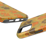 Two phone cases with orange and brown paw print design in different sizes, showing camera and port cutouts