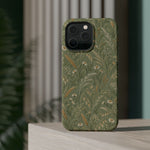 Golden Meadow – Sage Green Wildflower MagSafe Phone Case, glossy square triple-camera Pro model, rear view on a tabletop