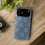 Lasso Hearts – Blue Western Heart MagSafe Phone Case, glossy wide-camera Pro Max model, rear view on a wooden surface