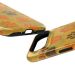 Two dog paw print phone cases showing size variant with yellow background and orange and brown paw designs