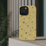 Prairie Stars – Yellow and Blue Star MagSafe Phone Case, glossy square triple-camera Pro model, rear view on a tabletop