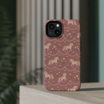 Rose Ponies MagSafe Phone Case, glossy diagonal dual-camera model, rear view on a tabletop