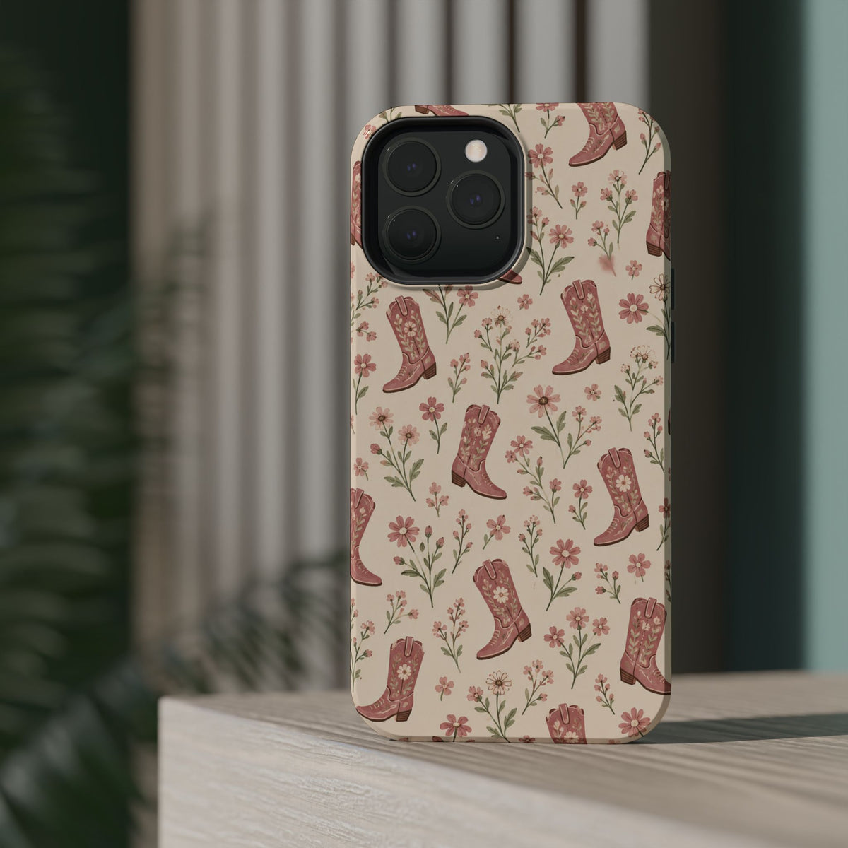 Floral Boots MagSafe Phone Case, glossy square triple-camera Pro model, rear view on a tabletop