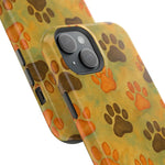 Two sizes of glossy phone cases with orange and brown paw print pattern on yellow background