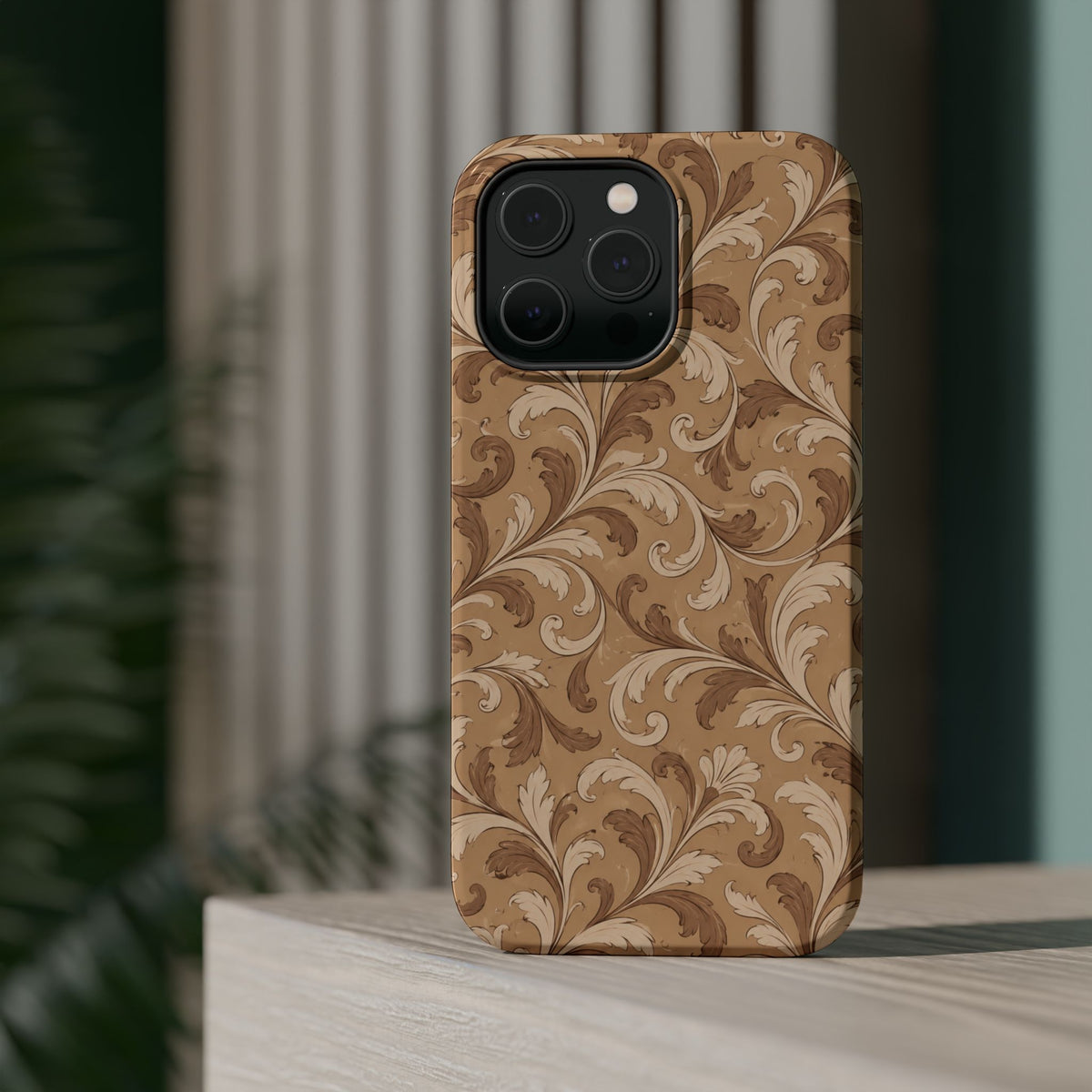 Saddle Scrolls – Tan Western Scrollwork MagSafe Phone Case, glossy square triple-camera Pro model, rear view on a tabletop