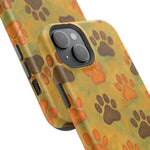 Two sizes of phone cases with orange and brown paw print pattern on greenish background