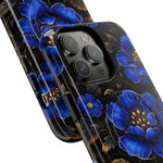 Two phone cases with blue floral design showing close-up of camera cutout, highlighting different sizes