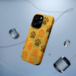 Yellow iPhone case with orange and brown paw prints, featuring triple camera cutout, variant size shown