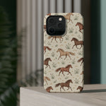 Wild Mustangs – Western Horse Pattern MagSafe Phone Case, glossy square triple-camera Pro model, rear view on a tabletop