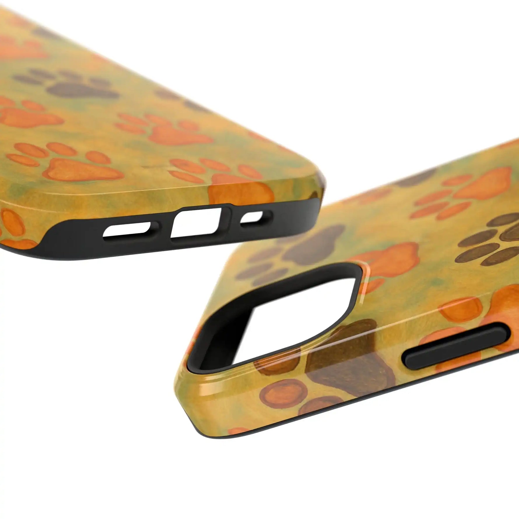 Close-up of two glossy phone cases with orange and brown paw print pattern, showing different sizes and cutouts
