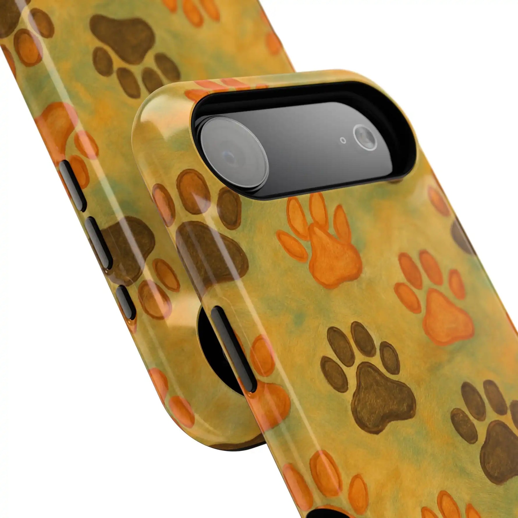 Close-up of two pet paw print phone cases with orange and brown paw patterns showing different sizes