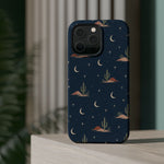 Desert Moon MagSafe Phone Case, glossy square triple-camera Pro model, rear view on a tabletop