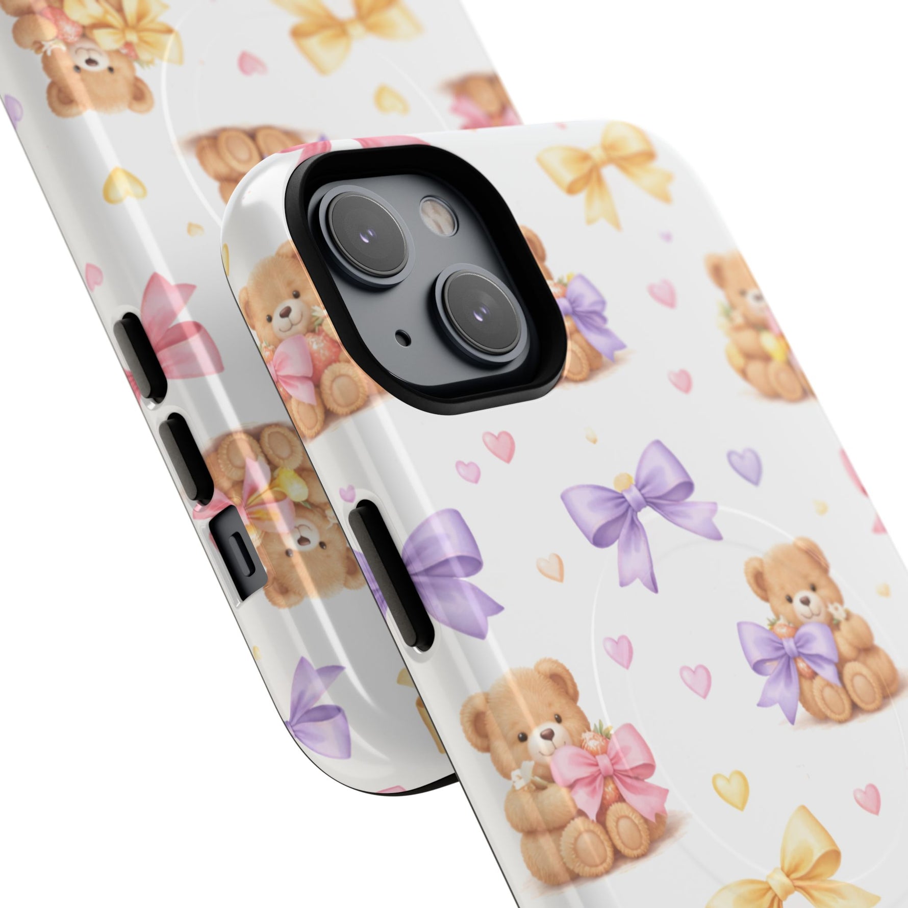 Close-up of two white phone cases with teddy bear and pastel bows pattern, showing variant sizes
