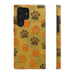 Phone case with orange and brown paw print pattern shown from front and side views