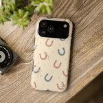 Prairie Horseshoes MagSafe Phone Case, glossy wide-camera Pro Max model, rear view on a wooden surface
