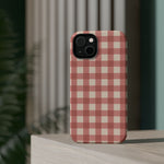 Prairie Gingham MagSafe Phone Case, glossy diagonal dual-camera model, rear view on a tabletop