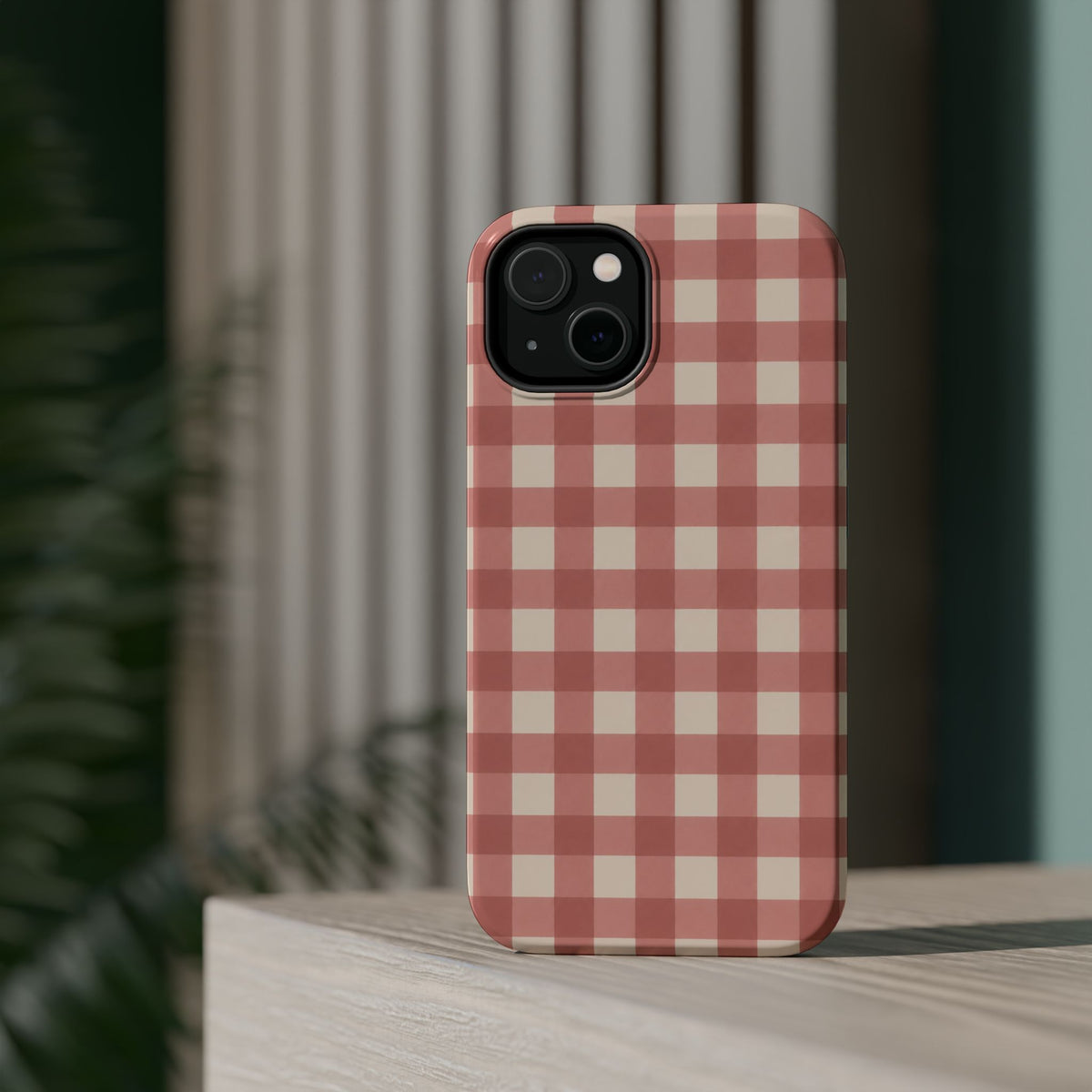 Prairie Gingham MagSafe Phone Case, glossy diagonal dual-camera model, rear view on a tabletop