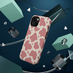 Rose Cowprint – Pink Cow Print MagSafe Phone Case, glossy diagonal dual-camera model, rear view with magnetic accessories
