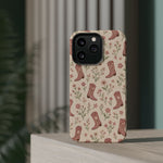 Floral Boots MagSafe Phone Case, glossy square triple-camera Pro model, rear view on a tabletop