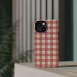Prairie Gingham MagSafe Phone Case, glossy diagonal dual-camera model, rear view on a tabletop