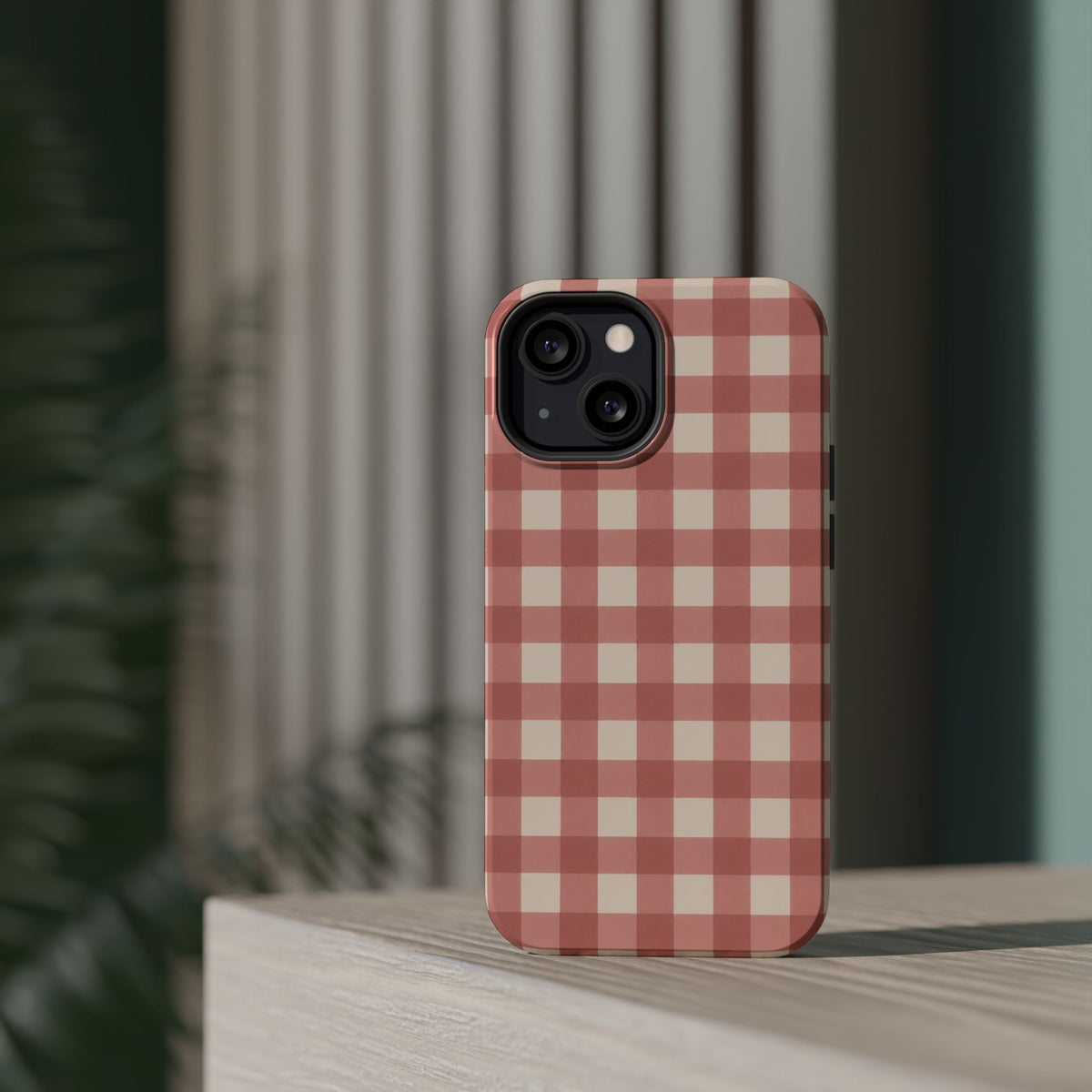 Prairie Gingham MagSafe Phone Case, glossy diagonal dual-camera model, rear view on a tabletop