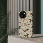 Wild Mustangs – Western Horse Pattern MagSafe Phone Case, glossy diagonal dual-camera model, rear view on a tabletop