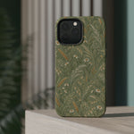 Golden Meadow – Sage Green Wildflower MagSafe Phone Case, glossy square triple-camera Pro model, rear view on a tabletop