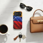 Flat lay with Venezuelan flag case and accessories