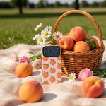 Peach-pattern wide-camera case beside a peach basket and flowers outdoors #iphone-18-pro