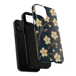 Exploded navy cherry-blossom case showing the phone, liner and shell with a diagonal dual-camera opening #iphone-15-plus