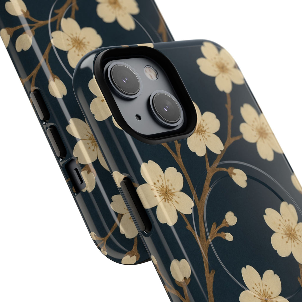 Close-up of overlapping navy cherry-blossom cases with diagonal dual-camera opening and side controls #iphone-14