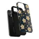 Exploded navy cherry-blossom case showing the phone, liner and shell with a square triple-camera opening #iphone-14-pro