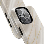 Close-up of overlapping white silk-and-gold cases with square triple-camera opening #iphone-16-pro-max