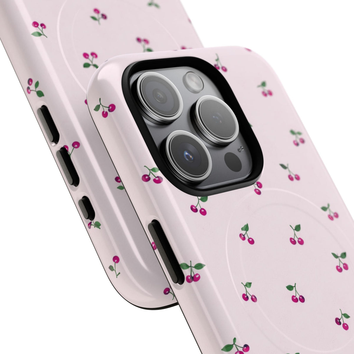 Close-up of overlapping cherry-pattern cases with square triple-camera opening #iphone-15-pro