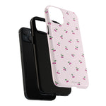 Exploded cherry-pattern case showing a diagonal dual-camera phone, liner and shell #iphone-14