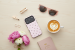 Cherry-pattern pink case in a top-down flat lay with flowers and coffee #iphone-17-pro-max