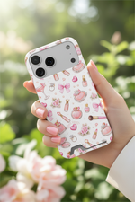 Boss Lady pink beauty card-slot case with wide triple-camera opening held outdoors among flowers #iphone-17-pro-max