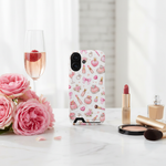 Boss Lady pink beauty card-slot case with vertical dual-camera opening on a cosmetics vanity #iphone-16