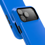 Close-up of overlapping cobalt blue cases with wide triple-camera opening and side controls #iphone-17-pro