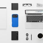 Cobalt blue wide-triple-camera case beside a laptop, notebooks, glasses and coffee #iphone-17-pro