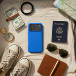 Cobalt blue wide-triple-camera case in a travel flat lay with passport, map and notebook #iphone-18-pro