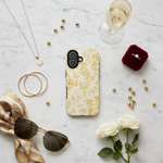 Marble flat lay with gold accessories